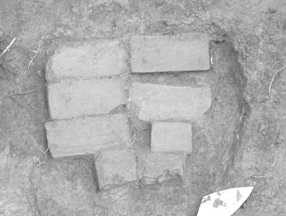 Lowest brick course from the Flint House archaeological excavation in porch square J3