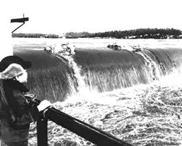 Water flowing over a dam